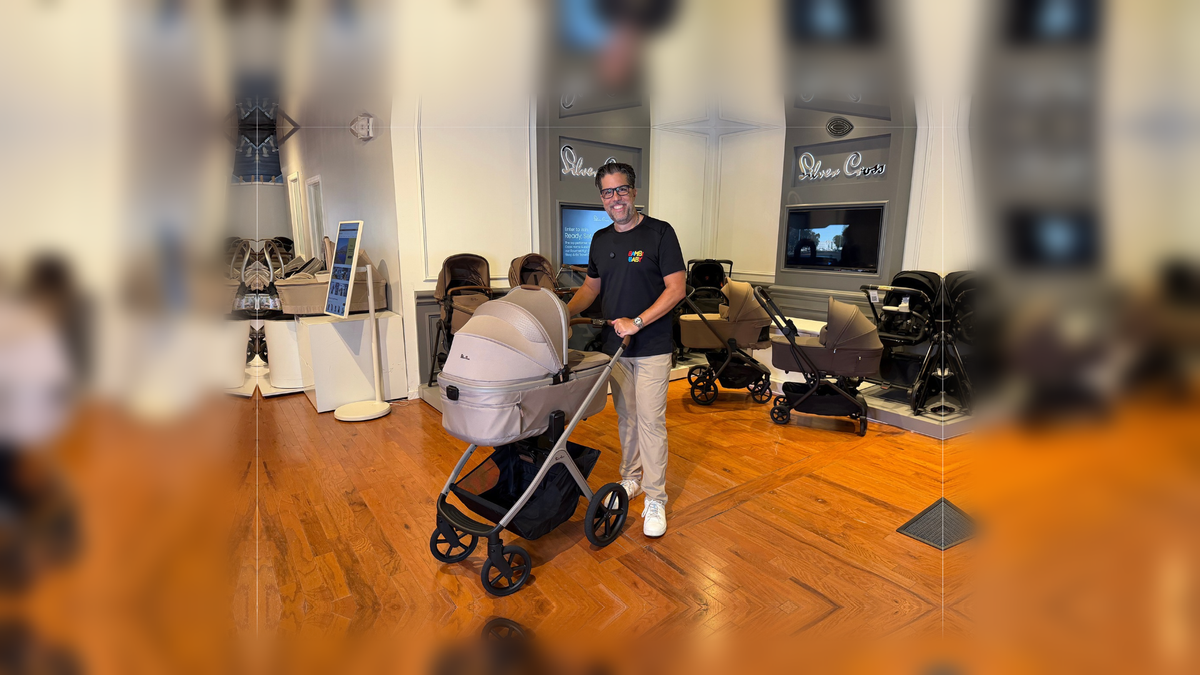 Enelio in a Bambi Baby Store with the Silver Cross Cove 2 stroller