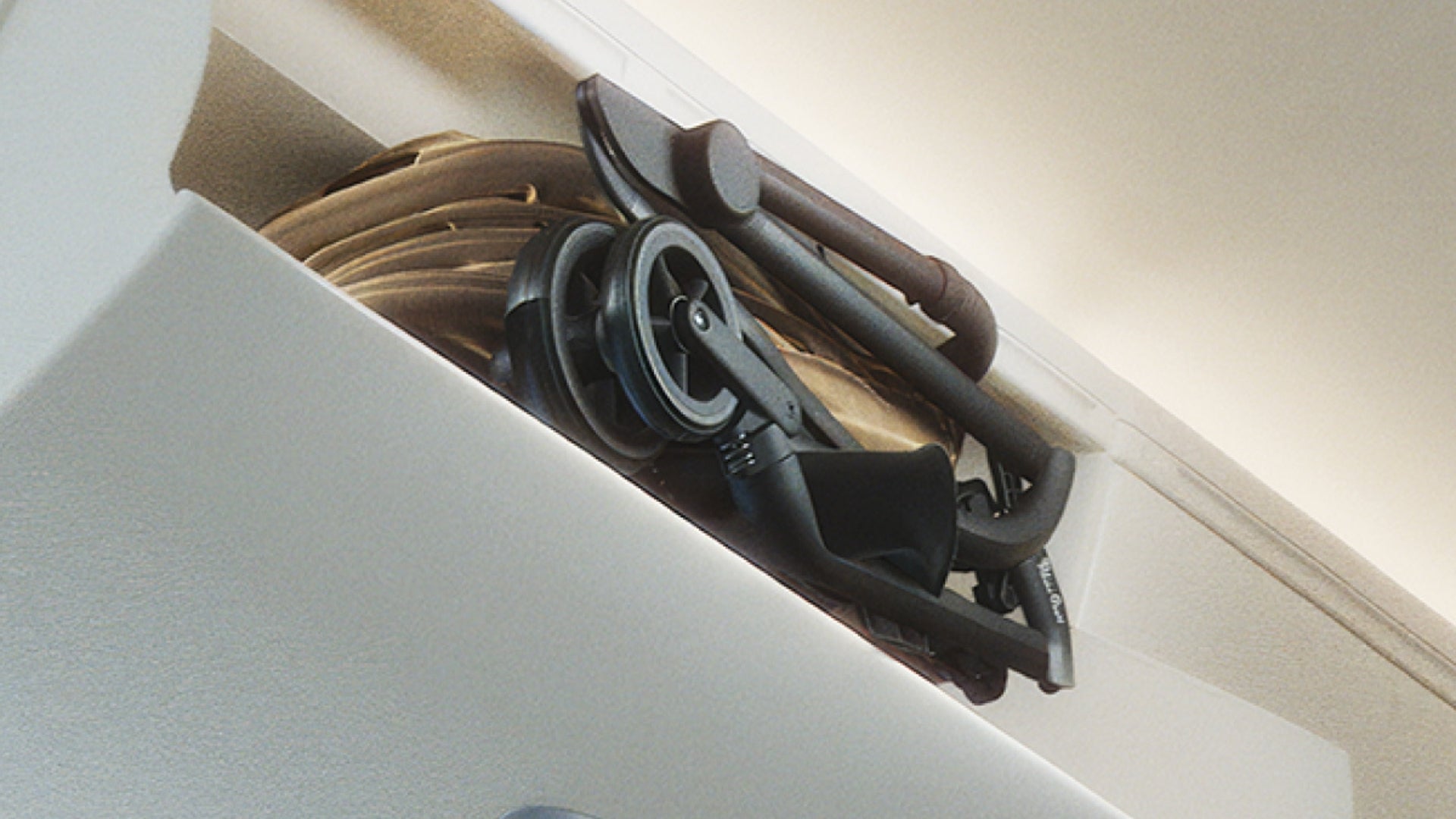 Silver Cross Nia in airplane over head bin