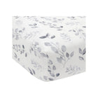Lambs & Ivy Painted Forest Fitted Crib Sheet, Gray Leaf Print on White Cotton - Side View | Bambi Baby
