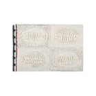 Natural Wool Washable Nursery Rug - Angled Top View Showing Cowrie Shell Texture Grid | Bambi Baby
