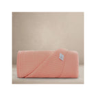 Rosette Pink Organic Cotton Muslin Throw Blanket - Rolled Studio View with Oilo Label | Bambi Baby