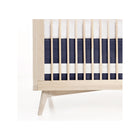 Navy Indigo Woven Cotton Crib Skirt - Front Panel View on Natural Wood Crib | Bambi Baby