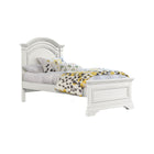 Brushed White Westwood Olivia Arch Top Twin Bed - Angled View with Bedding | Bambi Baby