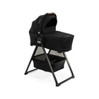 Caviar Black Nuna SWIV TRIV Series Bassinet and Stand - Angle View with Leather Handle | Bambi Baby
