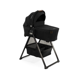 Caviar Black Nuna SWIV TRIV Series Bassinet and Stand - Angle View with Leather Handle | Bambi Baby