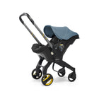 Cochecito infantil con asiento para coche Doona y base