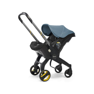 Cochecito infantil con asiento para coche Doona y base