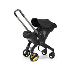 Cochecito infantil con asiento para coche Doona y base