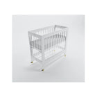 Pure White Acrylic Melo Caress Mini Foldable Crib with Gold Casters - Side Angled View | Bambi Baby