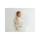 Beige Bamboo Swaddle Sleep Sack - Sleeping Newborn Overhead View | Bambi Baby