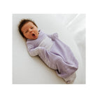 Lavender Knit Swaddelini Sleep Sack - Yawning Newborn Overhead View on White | Bambi Baby