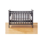 White Breathable Mesh Crib Liner in Dark Grey Crib - Front View on Wood Floor | Bambi Baby