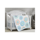 Blue Mandala Print Crib Quilt Draped Over Nursery Crib - Room Setting View | Bambi Baby