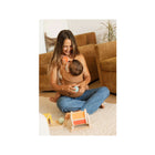 Mom Sitting on Floor with Baby in Willow Aerial Carrier - Playtime Scene | Bambi Baby