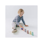 Toddler Arranging Silicone Stacking Friends Figures in a Row - Lifestyle Play Scene | Bambi Baby