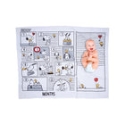 Smiling baby on Snoopy comic strip fleece milestone blanket month 5 highlighted - Lifestyle Overhead | Bambi Baby