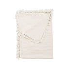Cream Cotton Waffle Knit Baby Blanket - Folded View with Tassel Trim Detail | Bambi Baby