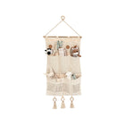 Beige Crochet Wall Storage Organizer with Wood Rod and Tassel Detail - Styled View | Bambi Baby