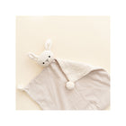 Cream Organic Cotton Bunny Lovey Blanket - Angled Flat Lay with Pom Detail | Bambi Baby