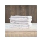 Arctic Snow Organic Cotton Muslin Duvet Cover - Rolled Stack Detail on Naturepedic Mattress | Bambi Baby