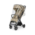 Clear Transparent Inglesina Quid Raincover - Angled Side View on Tan Lightweight Travel Stroller | Bambi Baby