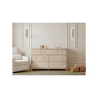 Whitewashed Ash Bellini Wells 7 Drawer Nursery Dresser - Wide Lifestyle Shot with Glider | Bambi Baby