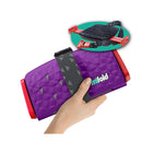 Royal Purple Mifold Comfort Grab-And-Go Compact Booster Seat - Folded View in Hand with Open Inset | Bambi Baby