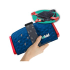 Ocean Blue Mifold Comfort Grab-And-Go Compact Booster Seat - Folded View in Hand with Open Inset | Bambi Baby