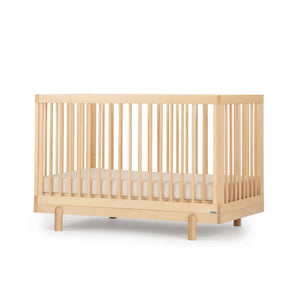 Natural Beechwood dadada Bliss 4-in-1 Convertible Crib - Angled Side View | Bambi Baby