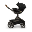 Nuna PIPA Urbn and DEMI Next with Rider Board Travel System in Caviar - Bambi Baby