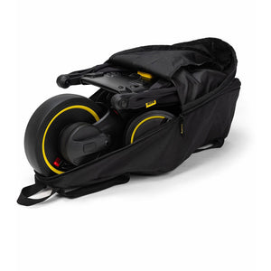 Black Doona Liki Travel Bag with Folded Trike Inside - Side View | Bambi Baby
